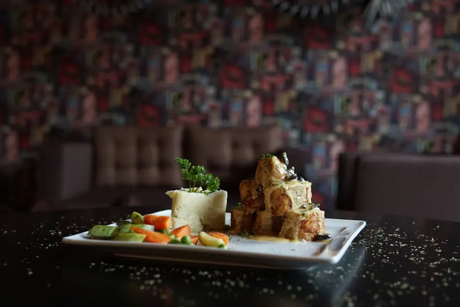 Roasted lamb shoulder served with colorful vegetables — a signature Olive & Ember dish